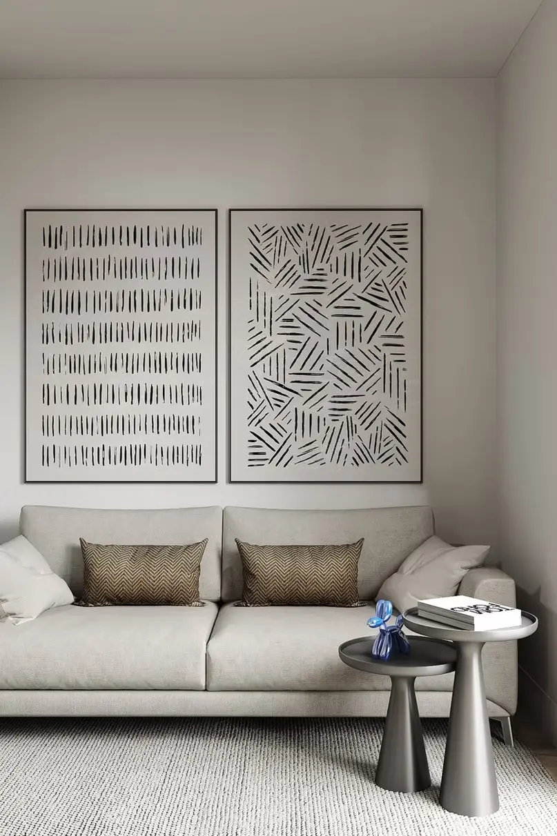 AZULIS Apartments: beige designer sofa beneath two abstract monochrome artworks, Olbia