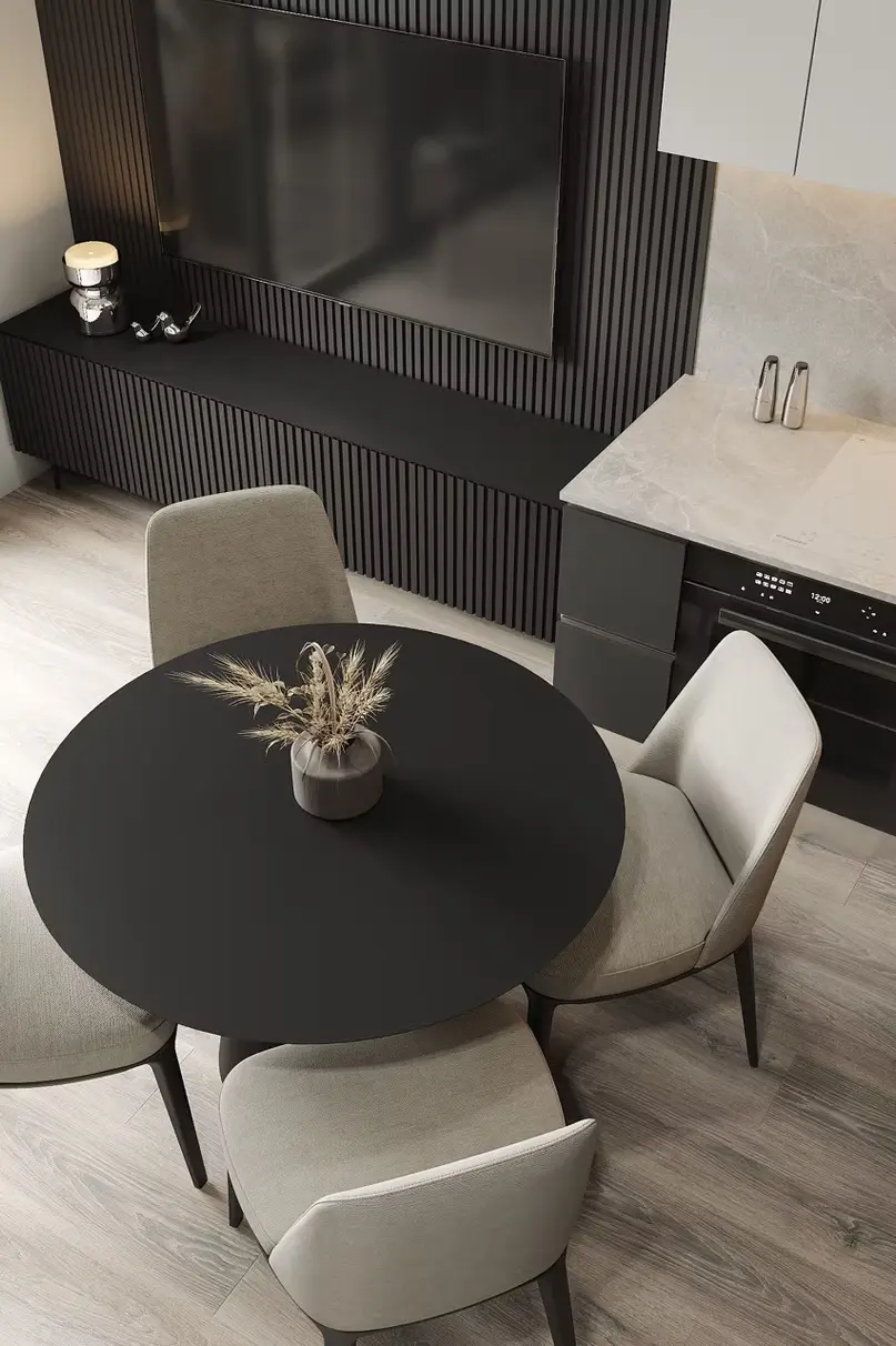 AZULIS Apartments: round black dining table with beige chairs beside the kitchen and media wall, Via Pisano 16, Olbia