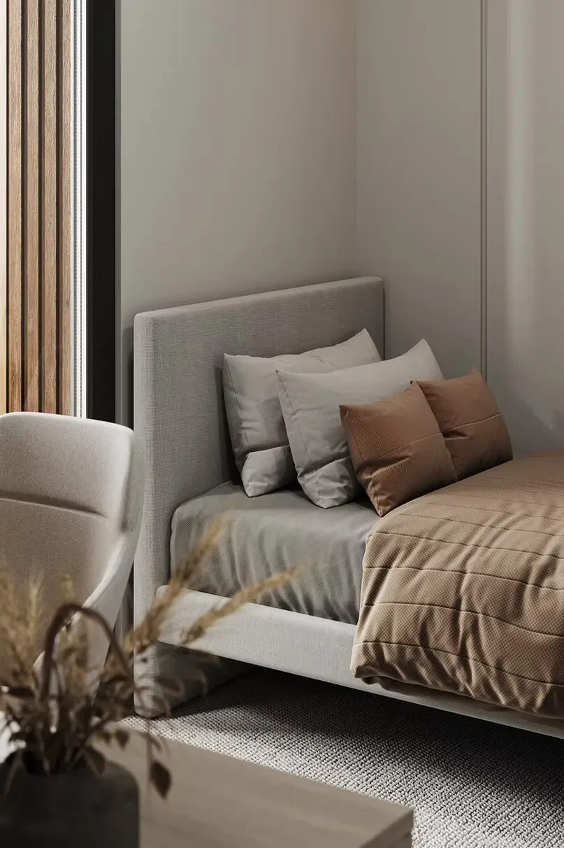 AZULIS Apartments: bedroom corner with upholstered bed and layered pillows in warm earth tones, Olbia