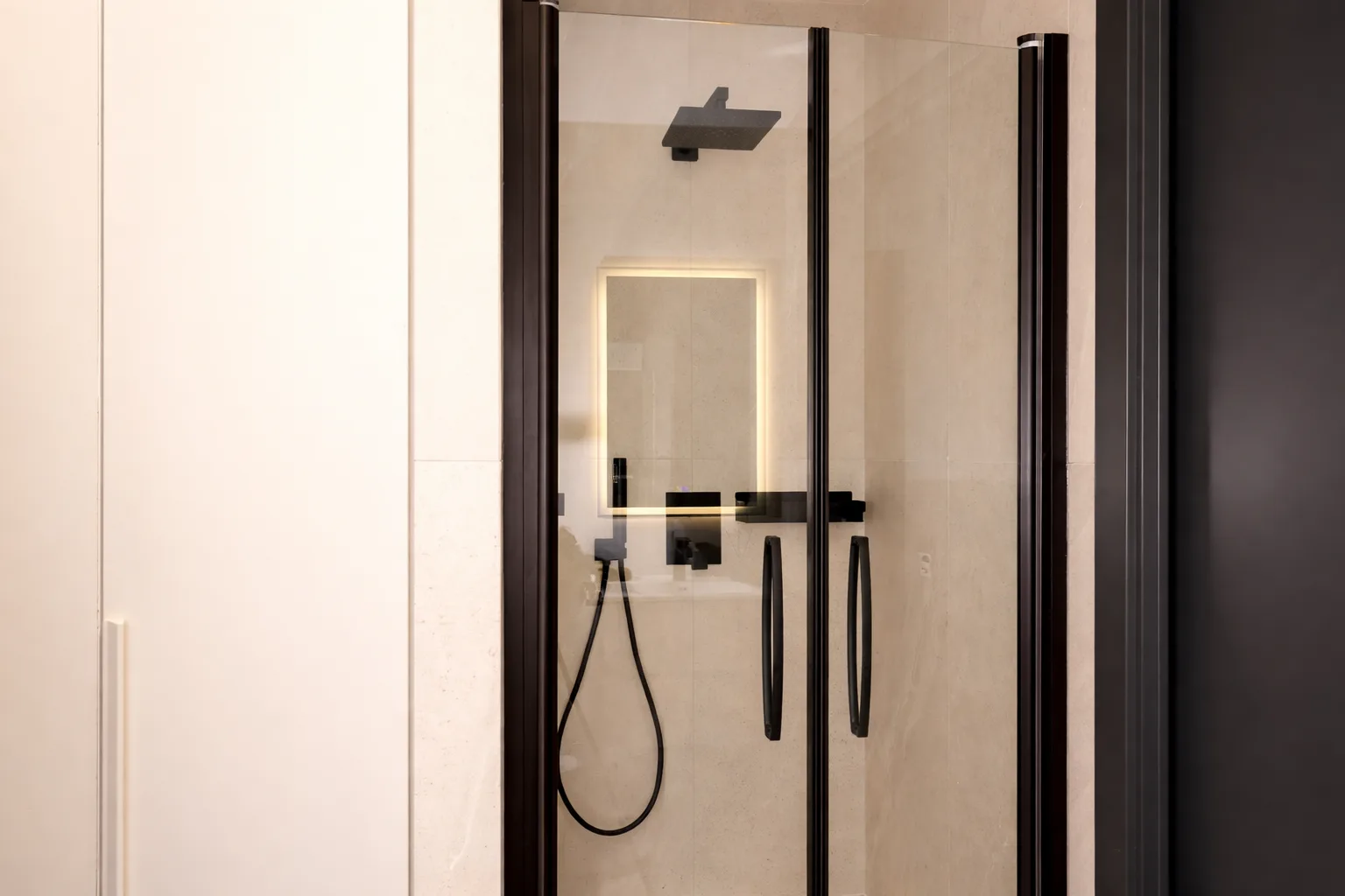 AZULIS Apartments: designer bathroom with walk-in rain shower and backlit mirror behind glass, Via Pisano 16, Olbia