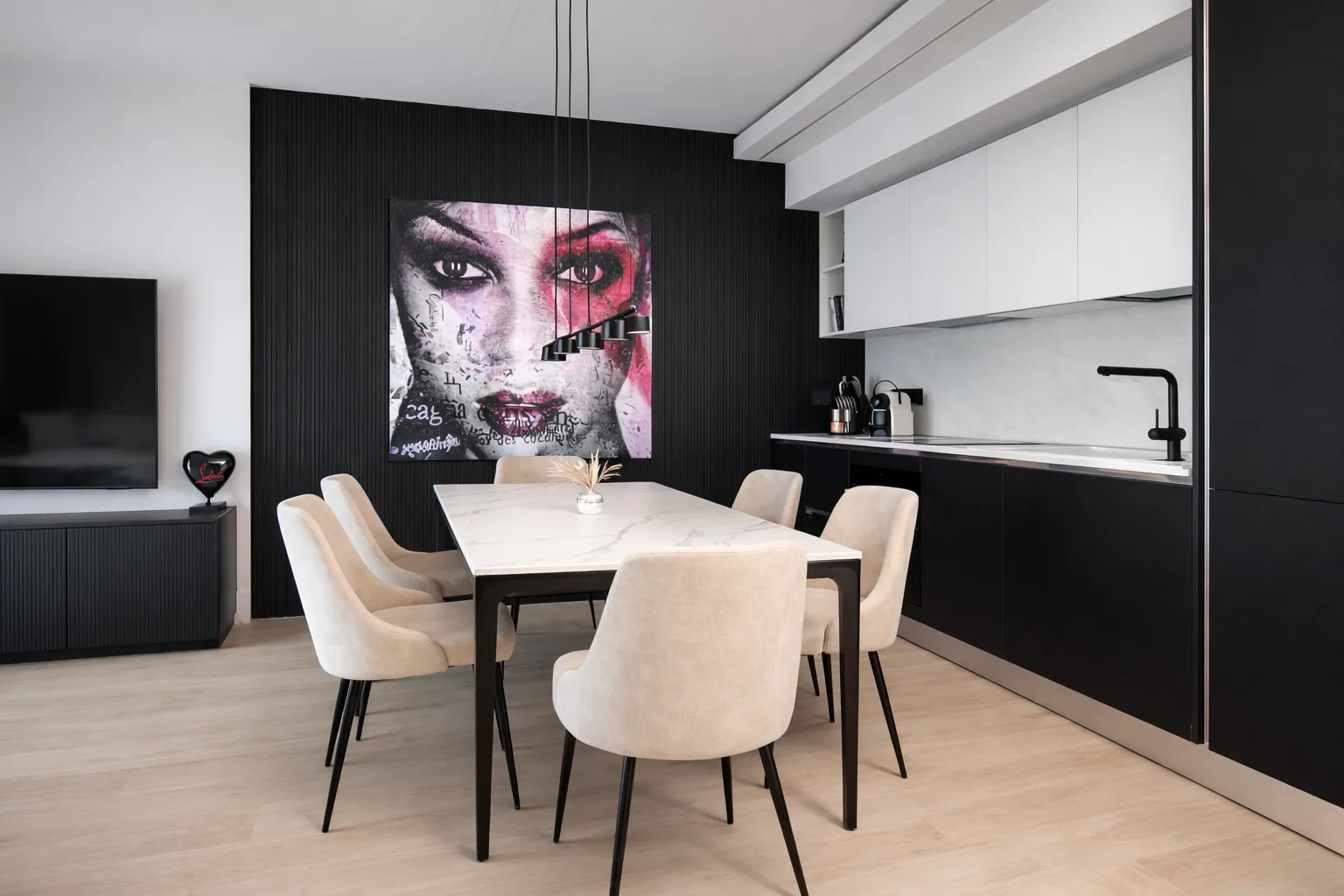 AZULIS Apartments: kitchen and dining area with black cabinetry, marble table and portrait artwork, Via Pisano 16, Olbia